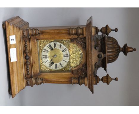 A late Victorian walnut mantel clock
