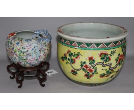 A 19th century famille rose water pot and famille vert planter