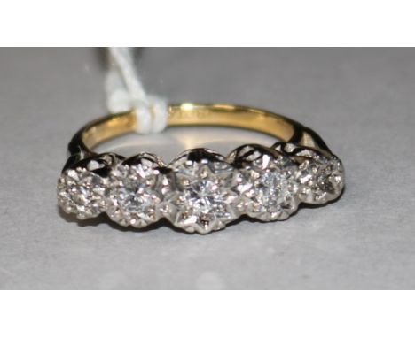 An 18ct gold, platinum and graduated five stone illusion set diamond ring, size K.