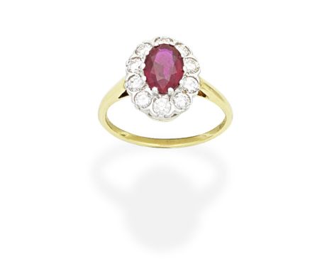 RUBY AND DIAMOND CLUSTER RINGSet with an oval-cut ruby within a brilliant-cut diamond surround, diamonds approx. 0.50ct total