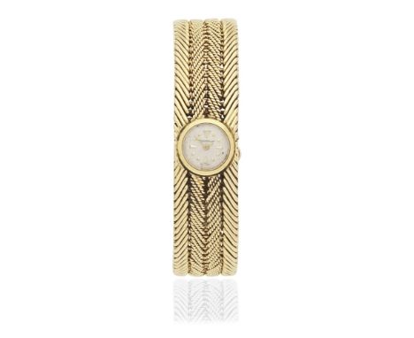 KUTCHINSKY FOR JAEGER-LECOULTRE: WATCH/BRACELET,  1961The circular dial with dot and baton hourmarkers, within an 18 carat go