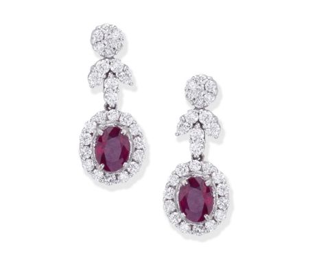 RUBY AND DIAMOND EARRINGSEach oval-cut ruby within a brilliant-cut diamond surround, suspended from a similarly-cut diamond s