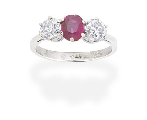 RUBY AND DIAMOND THREE-STONE RINGThe oval-cut ruby between old brilliant-cut diamonds, diamonds approx. 1.35cts total, ring s