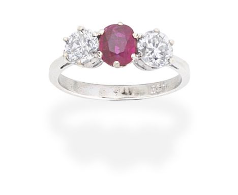 RUBY AND DIAMOND THREE-STONE RINGThe oval-cut ruby between old brilliant-cut diamonds, diamonds approx. 1.35cts total, ring s