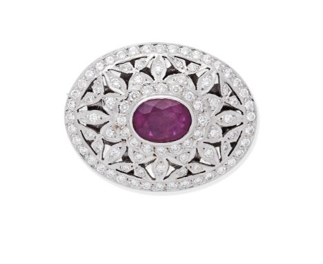RUBY AND DIAMOND BROOCHOf plaque design, set with an oval-cut ruby within an openwork foliate surround set with brilliant-cut