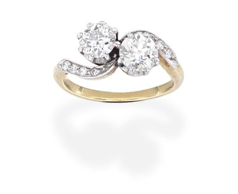 DIAMOND TWO-STONE RINGOf crossover design, set with two old brilliant-cut diamonds between single-cut diamond shoulders, diam