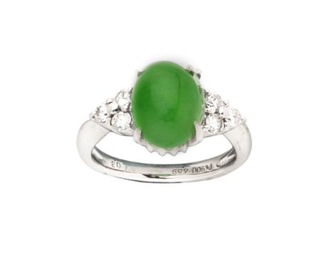 JADE AND DIAMOND RINGThe oval jadeite jade cabochon, between trios of brilliant-cut diamonds, ring size approx. K, Footnotes: