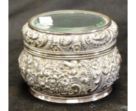 American Wilcox silver plate trinket box with ornate embossed decoration and mirror top, diameter 10cm approx