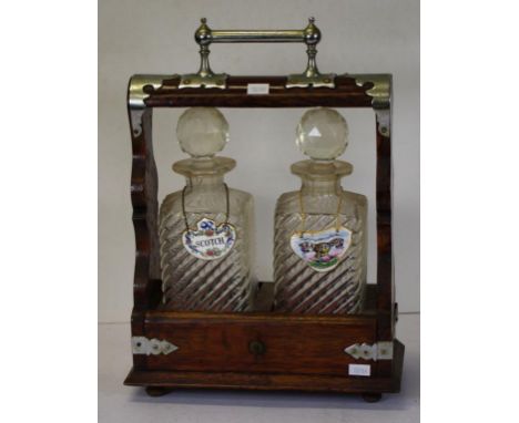 Vintage oak dual crystal decanter tantalus in oak frame with silver plate fittings, (worn), a pair cut crystal decanters, key