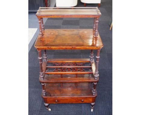 Antique walnut canterbury music stand metal gallery to raised top level, to turned columns supporting fitted segmented base, 