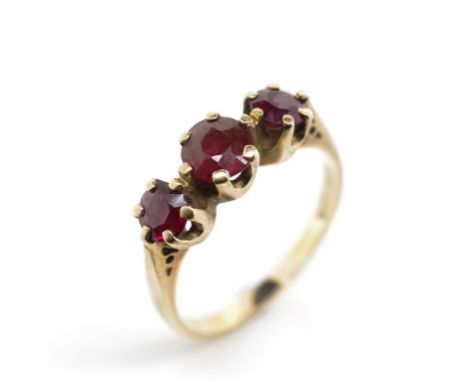 9ct yellow gold and garnet set three stone ring marked 9ct Jaye. Approx ring size R-S, weight 3.7 grams