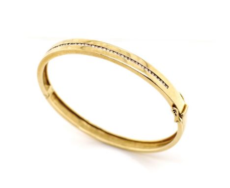 Half ct diamonds and 9ct yellow gold bangle with hinge, box clasp and safety catches. Channel set with approx 50x round brill