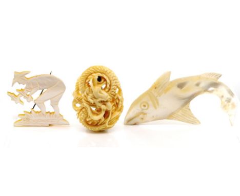 Three hand carved brooches includes a well carved Chinese ivory dragon from the early 20th century, as well as a carved mothe