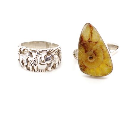 An ammonite set silver ring together with another silver ring depicting the big five in safari. Both marked 925