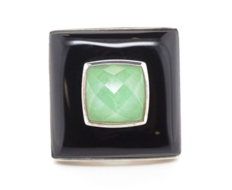 Art Deco style silver cocktail ring set with a faceted square cushion cut green gemstone and a a enamel border. Marked 925. A