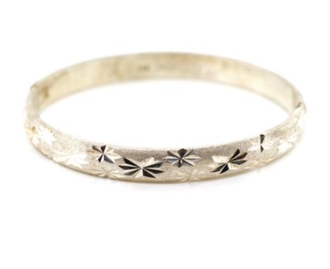 Sterling silver hinged "child's"bangle with star cut decoration and two tone high polish and matte finish. Approx weight 22 g