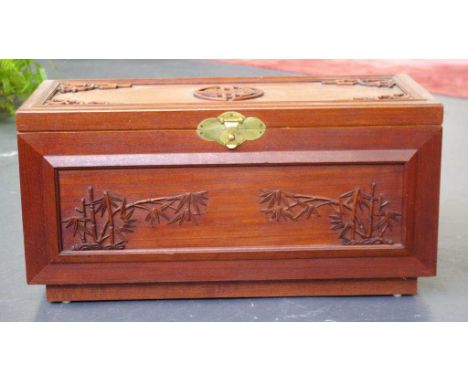 Small Chinese camphorwood trunk with ornate carving, 79cm wide, 33cm deep, 39cm high approx