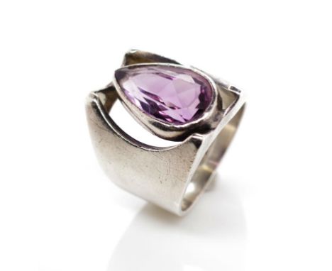 Australian Modernist silver and amethyst ring with a hand made mount and shank marked Greig Design STG SIL. and a bezel set p
