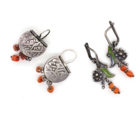 Two pairs of silver and coral earrings includes a pair with Islamic silver coins and hanging coral beads, as well as a floral