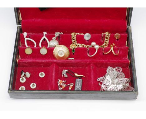 A group of costume jewellery and box includes a manual wind pendant watch, earrings, bracelets and a vintage leather jeweller