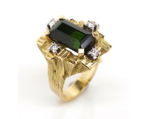 Tourmaline and diamond set 18ct yellow gold ring in the cubist manner. Marked 18ct. Approx emerald cut  green tourmaline 13.2