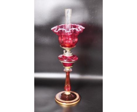 Victorian ruby glass oil lamp with Greek key gilt decoration &amp; Albion Lamp Birmingham burner, 61cm high approx.