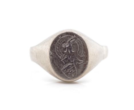 White gold Signet ring engraved with crest, with rubbed marks. Approx weight 6.8 grams, ring size P. Test as 18ct