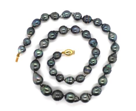Tahitian pearl necklace with a diamond set 18ct yellow gold clasp. Approx 8mm - 10.6mm cultured ringed pear shaped pearls. Ne