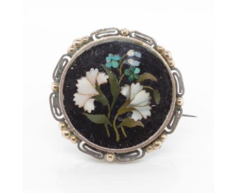 Antique Petra dura brooch with a silver and gilt surround. Approx width 29mm