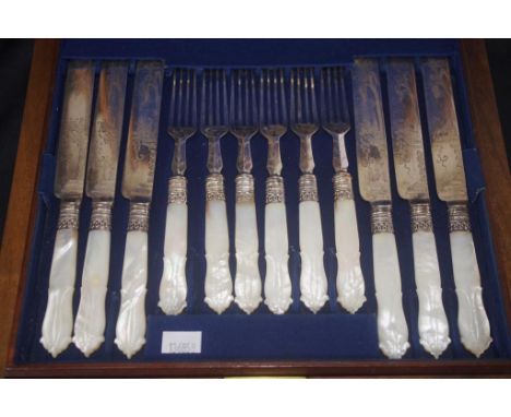 Cased mother of pearl fruit knives and forks with silver plate blades and tines.