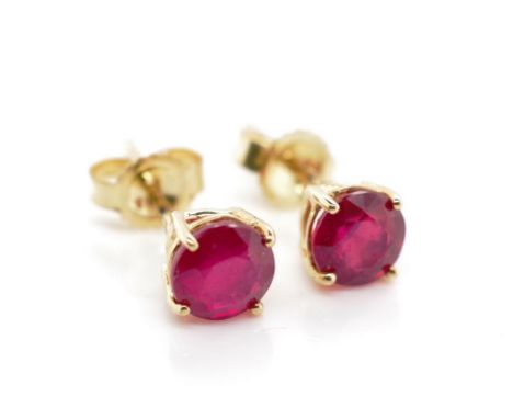 Ruby and 10ct gold stud earrings marked 10k. Approx 4.8mm diameter treated ruby