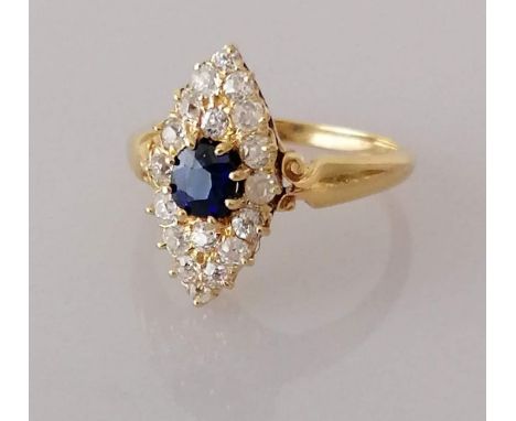 An antique sapphire and diamond navette dress ring on a yellow gold setting, the cushion-cut sapphire, 0.63 carats5 x 6mm sur