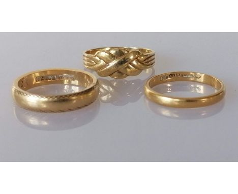 A 22ct yellow gold wedding band, 2mm, 2.5g; another 18ct yellow gold, 3mm, both hallmarked and a yellow gold ring with woven 