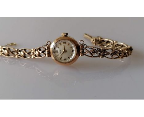 A mid century Tissot ladies manual wristwatch with a 9ct yellow gold case and bracelet, hallmarked, 13.83g without mechanism,