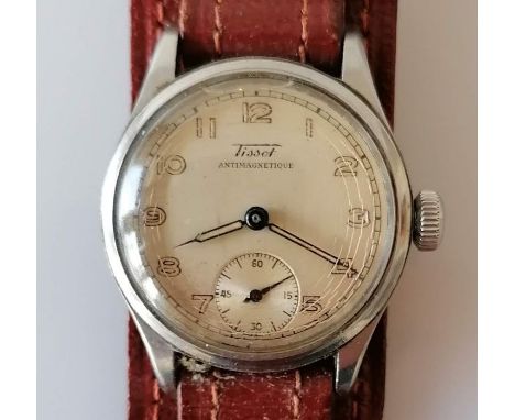 A vintage Tissot Antimagnetic watch with champagne dial, 27mm, Arabic numerals, luminous hands, subsidiary seconds hand and l