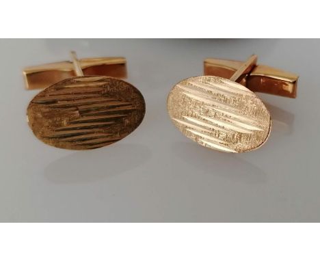 A pair of textured gold oval cufflinks, hallmarked for London, 1970, 6.5g, two silver cigarette cases with engine turned deco