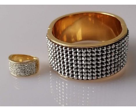 A Swarovski gold-coloured cuff hinged bangle and similar ring (2)