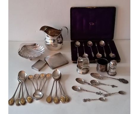 A George III London silver cream jug with etched decoration, marks rubbed; an Edwardian silver scallop dish by Atkin Brothers