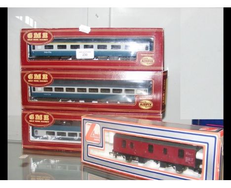 Three boxed GMR carriages, together with a Lima freight 