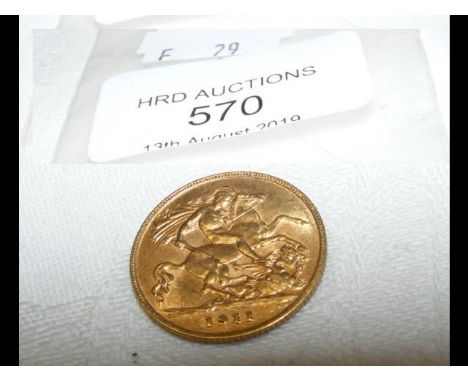 A 1911 gold half sovereign coin 