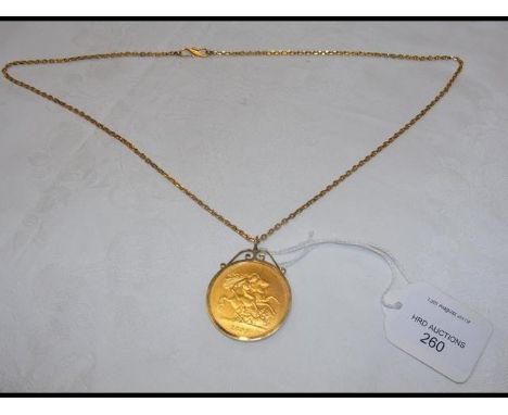 An 1893 gold five pound coin - 40g - in mount with gold chain CONDITION REPORTApproximate total weight - 58.4g; coin removabl