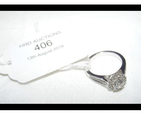 A 1.24ct total single stone halo ring in 18ct white gold setting 