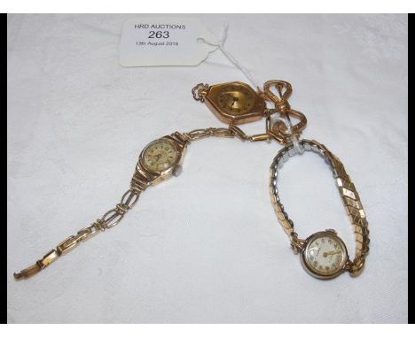 A lady's 18ct gold wrist watch, together with two others 