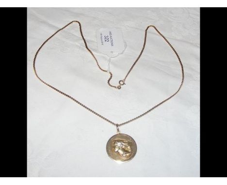 A 750 marked gold pendant and chain - 21g 