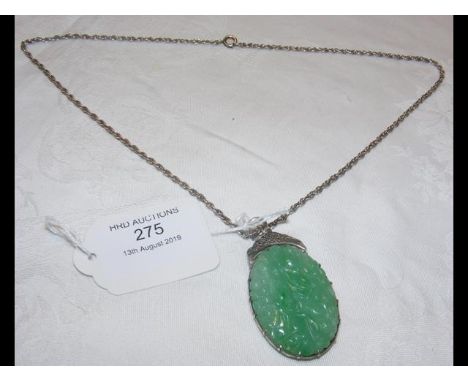 A jade pendant on chain CONDITION REPORT4cm x 3cm