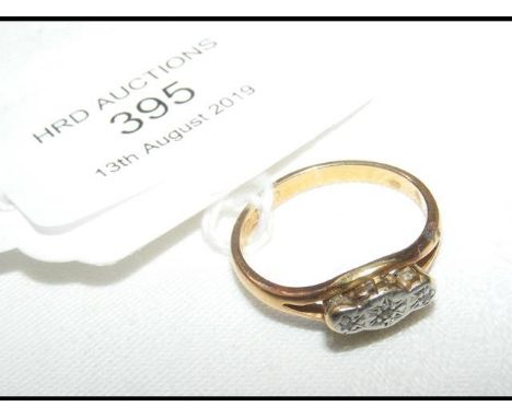 A diamond ring in 22ct gold setting 