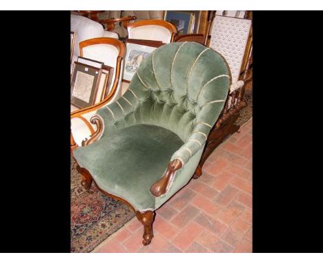A Victorian button back easy chair with cabriole front supports 