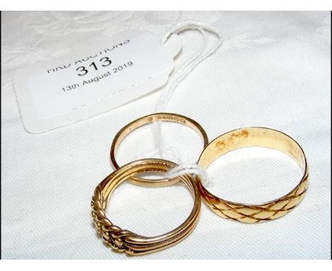 A gent's gold ring, together with two gold bands CONDITION REPORTapproximate total weight 10g