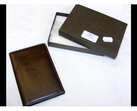 A Patek Philippe leather wallet and notepad with paper - in original box 