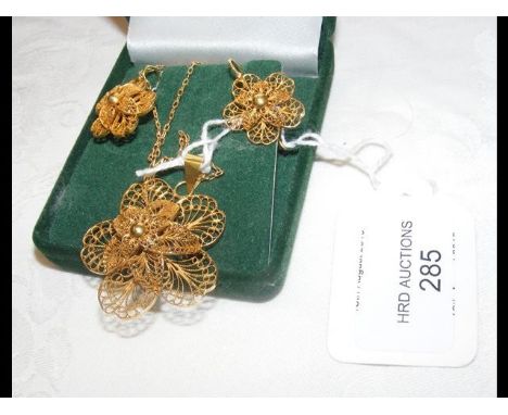 A lady's gold filigree pendant on chain with the matching earrings CONDITION REPORTApprox total weight 10.8g - 9k